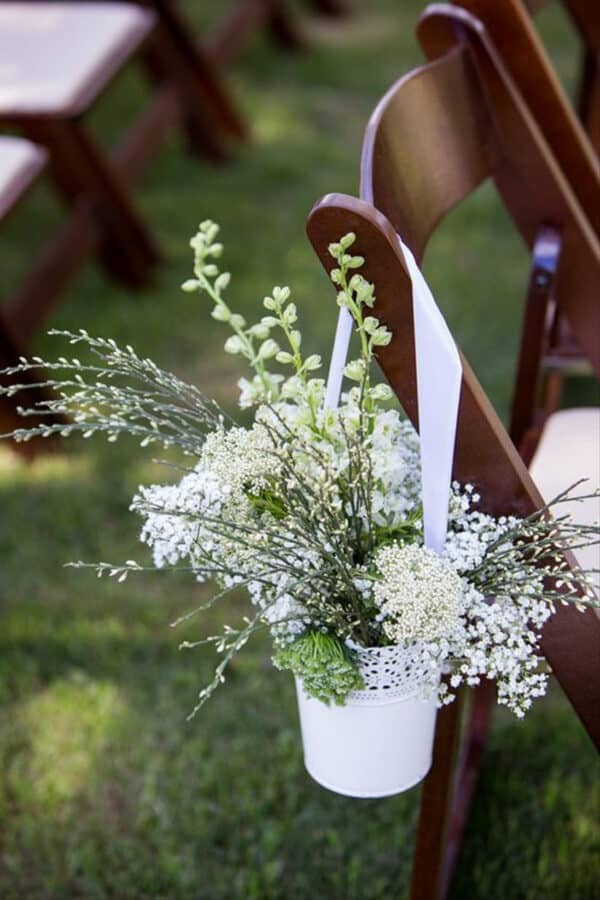 white lace hanging containers with flowers.