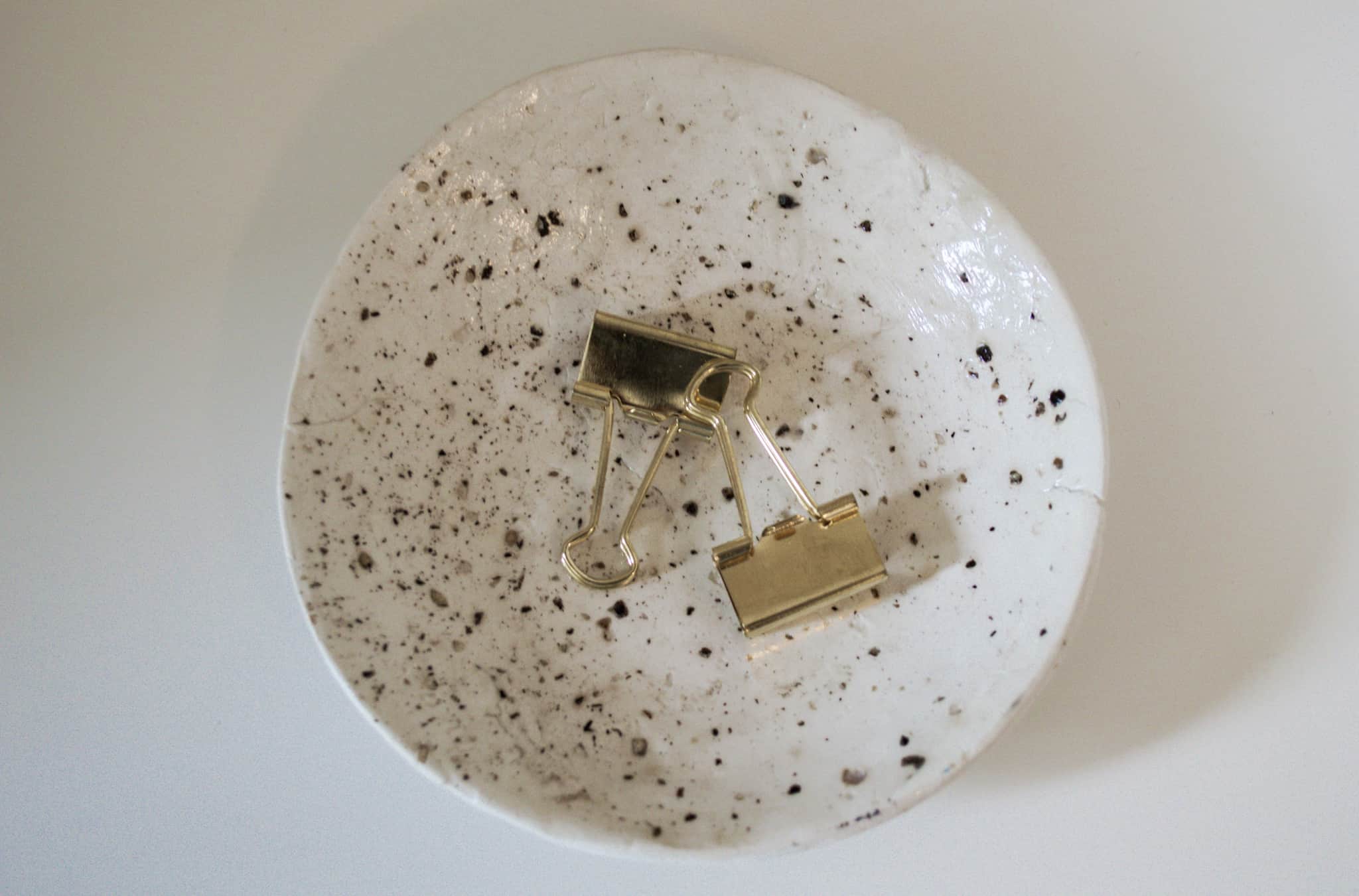 Cream and black speckled bowl.