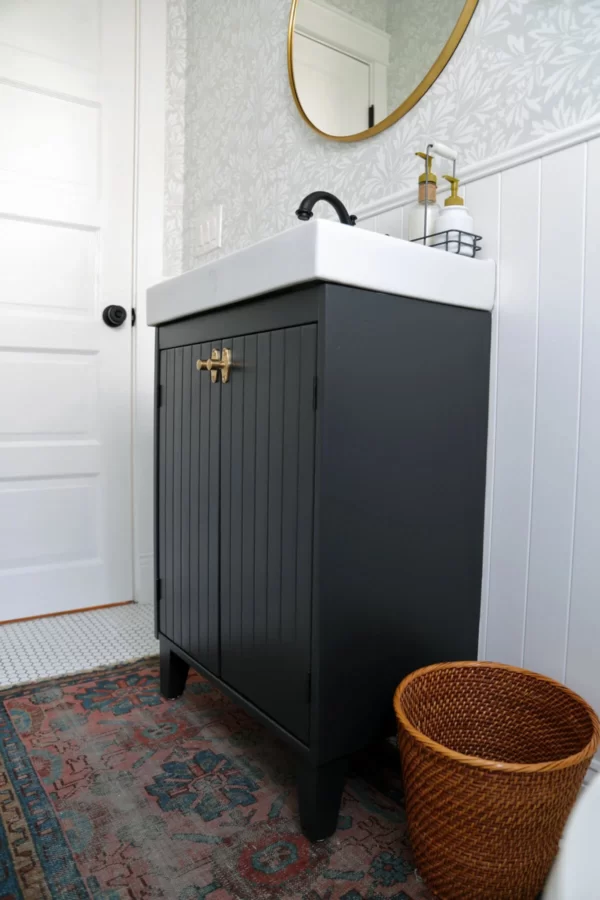 Black panelled vanity unit in bathroom