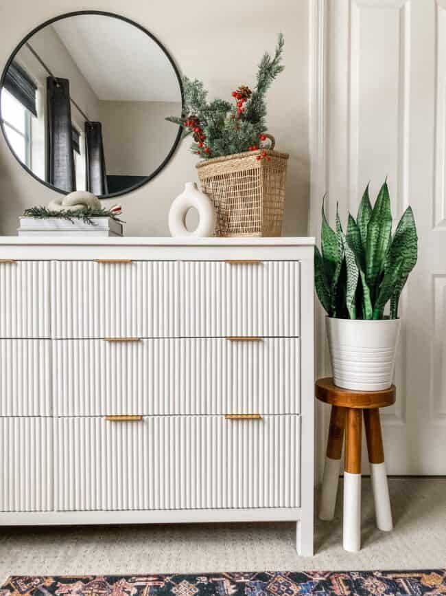 White IKEA Hemnes dresser with decorative fluted wood front.