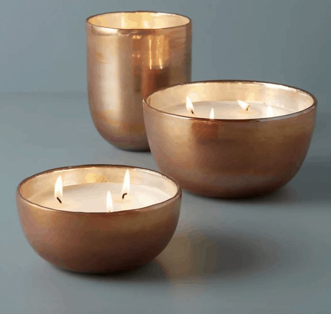 copper colored round glass candle.
