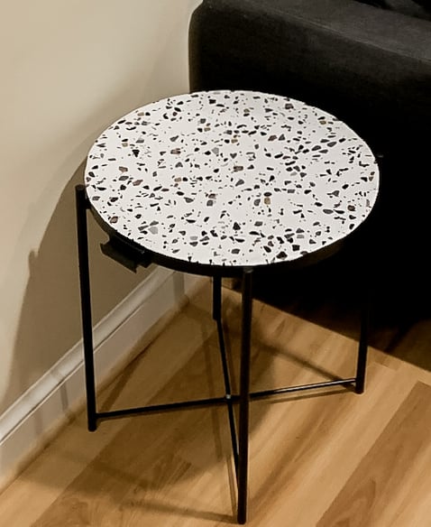 Terrazzo and black round circular side table