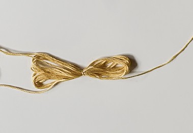 Yellow thread tassel.