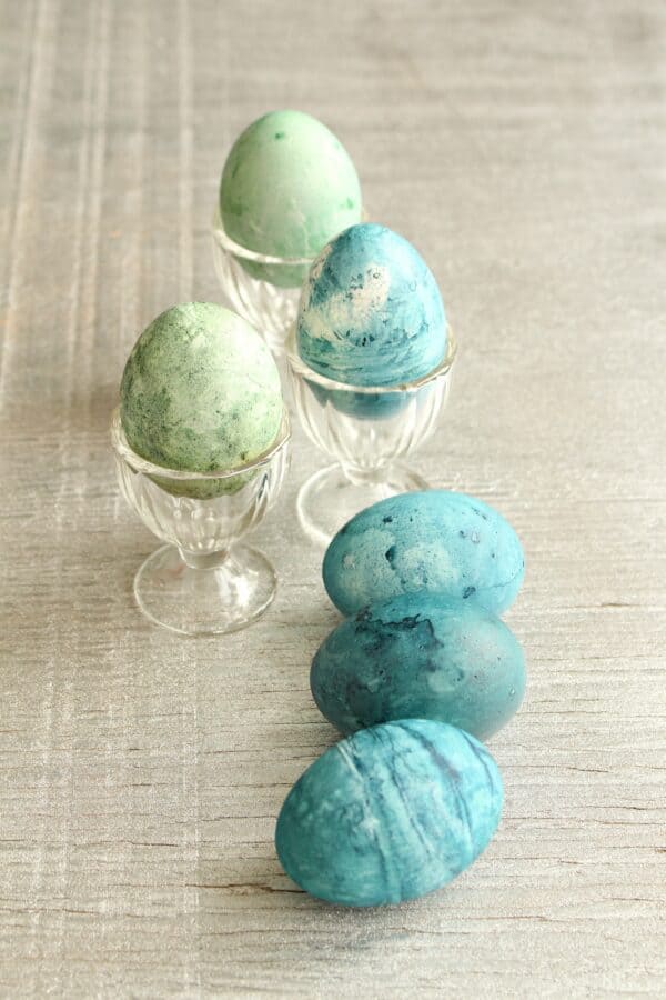 Blue and green speckly marbled eggs