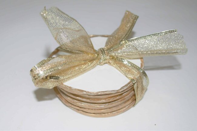 Coasters tied with gold ribbon