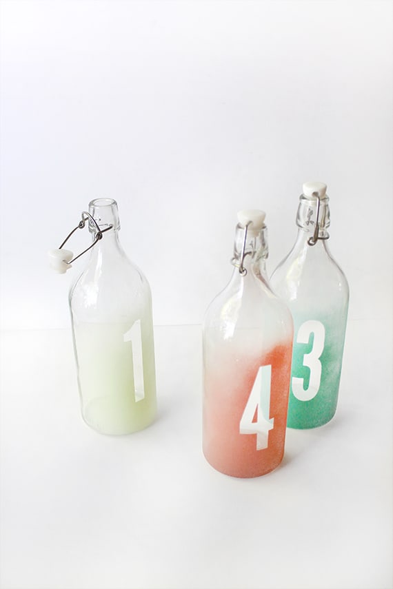 Glass bottles with ombre numbers.